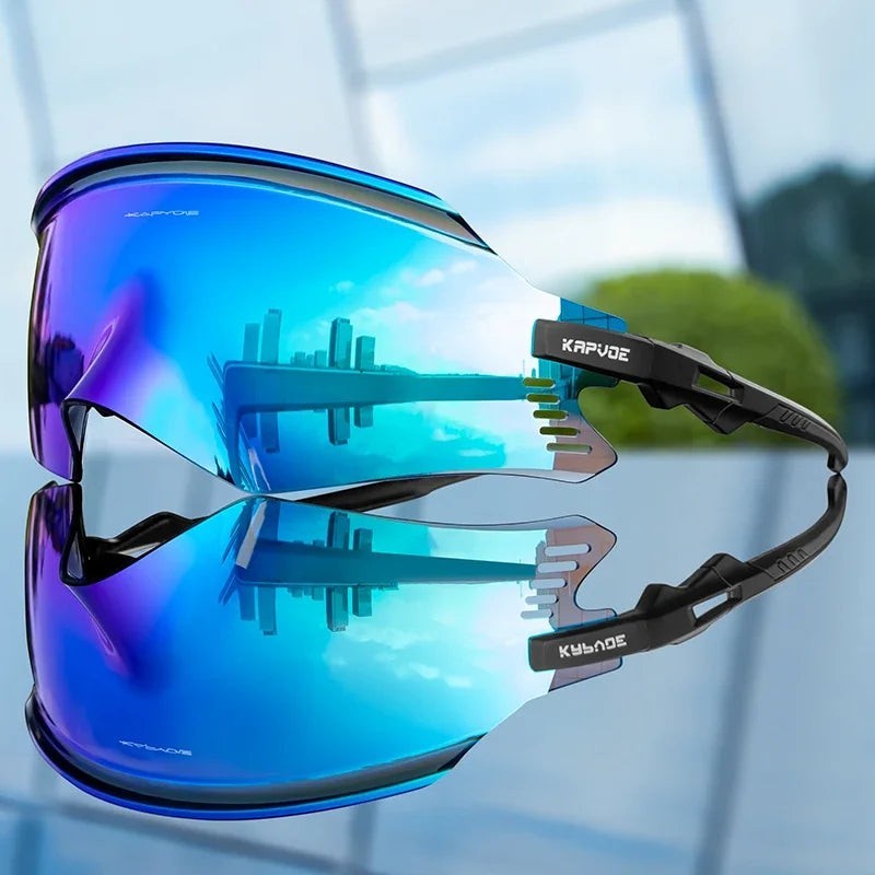 Velovoila KAPVOE UV400 cycling sunglasses with a blue mirrored shield lens and black frame for road and mountain biking.
