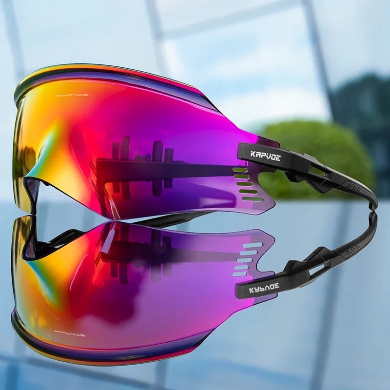 Velovoila KAPVOE cycling sunglasses featuring a reflective rainbow shield lens and black frame for road and MTB riding.